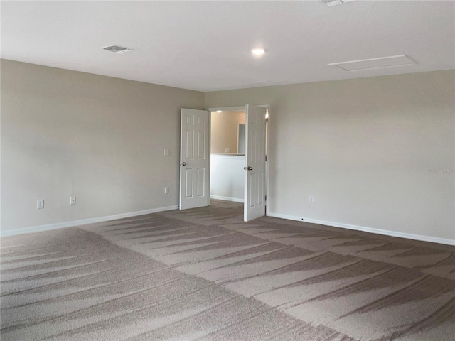 empty room featuring dark colored carpet