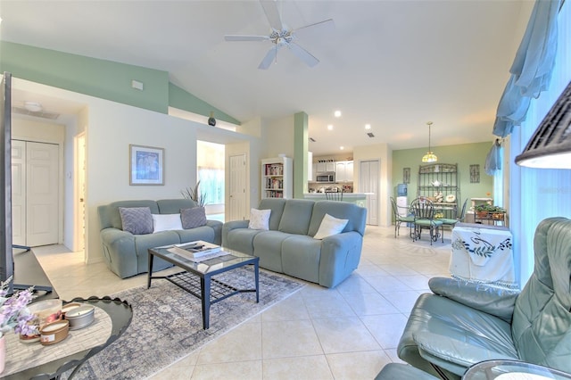 living room with light tile patterned floors, vaulted ceiling, and ceiling fan