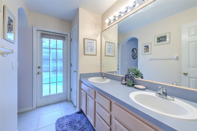 bathroom with tile patterned flooring and vanity