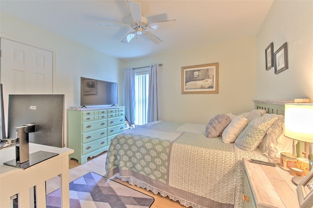 bedroom with light wood-type flooring and ceiling fan