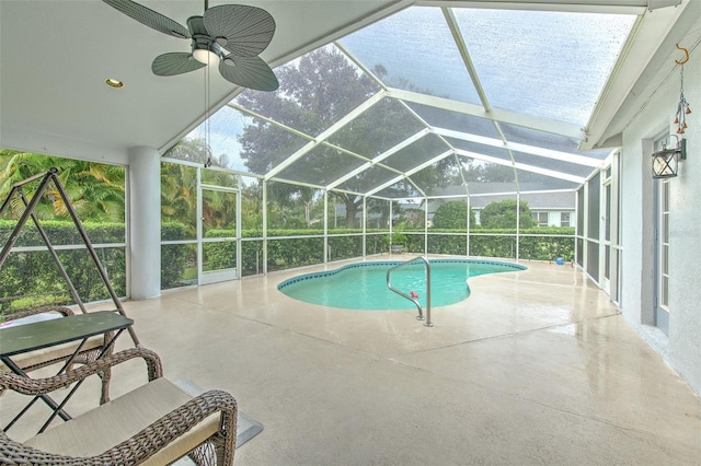 view of swimming pool with a lanai, a patio, and ceiling fan