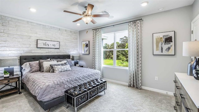 bedroom with ceiling fan and light carpet