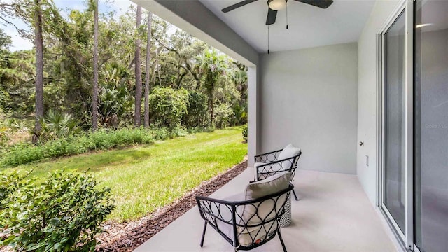 view of patio featuring ceiling fan