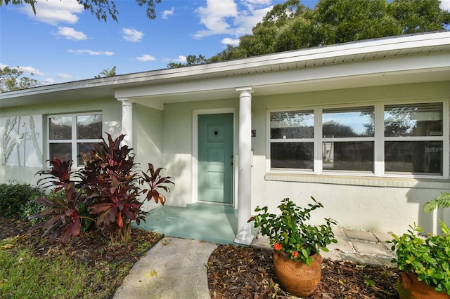 property entrance featuring a porch