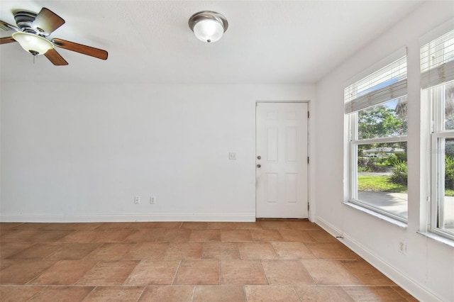 spare room with ceiling fan