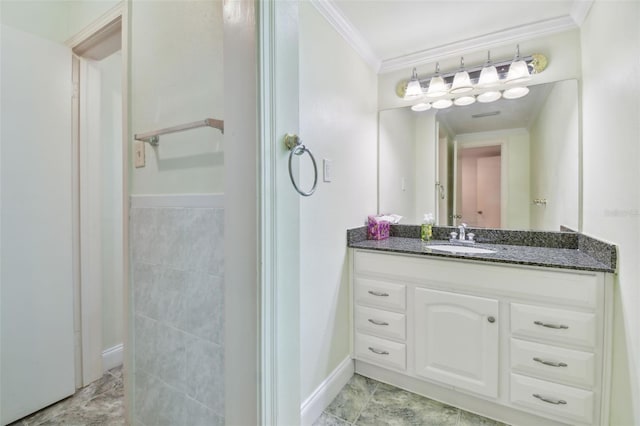 bathroom featuring crown molding and vanity