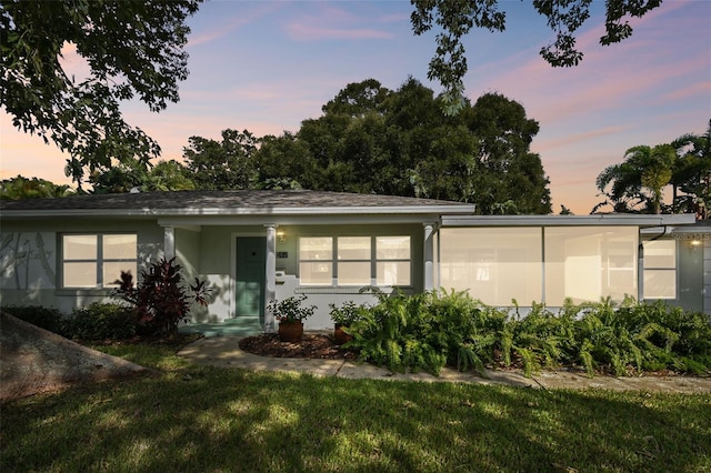 view of front of home with a lawn