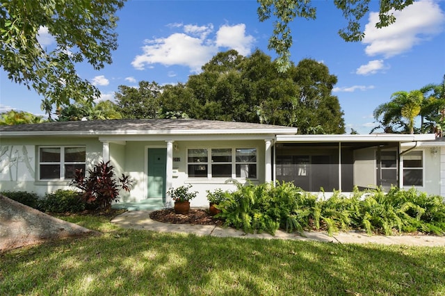 single story home with a front lawn