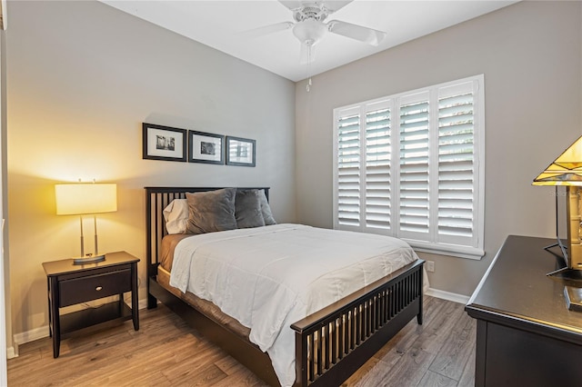 bedroom featuring hardwood / wood-style floors and ceiling fan