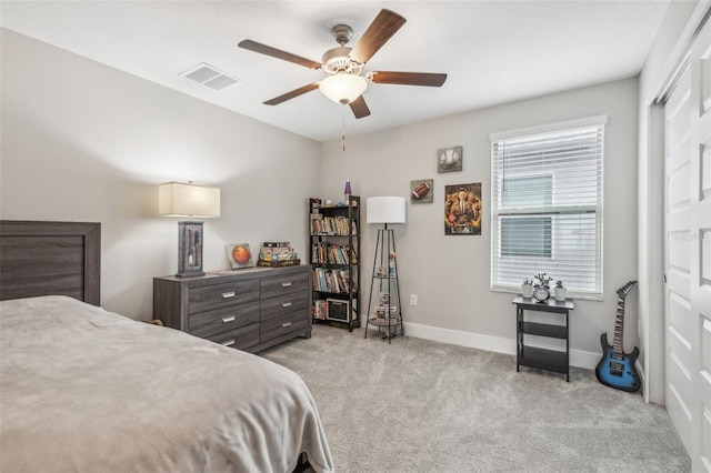 bedroom with light carpet and ceiling fan