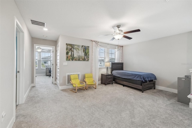 bedroom featuring ceiling fan and light colored carpet