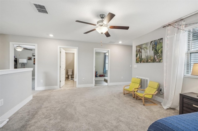 sitting room featuring light carpet and ceiling fan