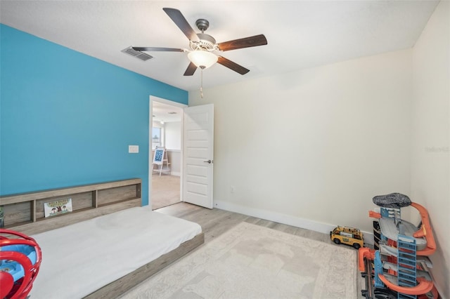 bedroom featuring light wood-type flooring and ceiling fan