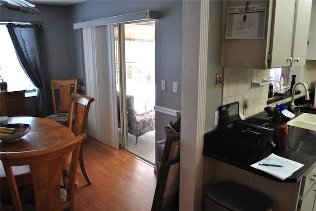 kitchen featuring decorative backsplash and hardwood / wood-style flooring