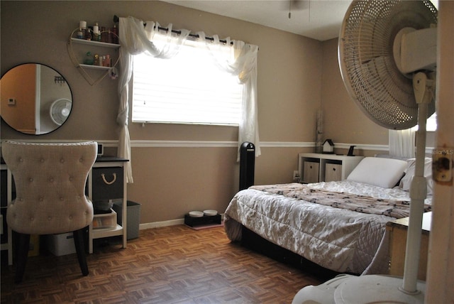 bedroom with dark parquet floors