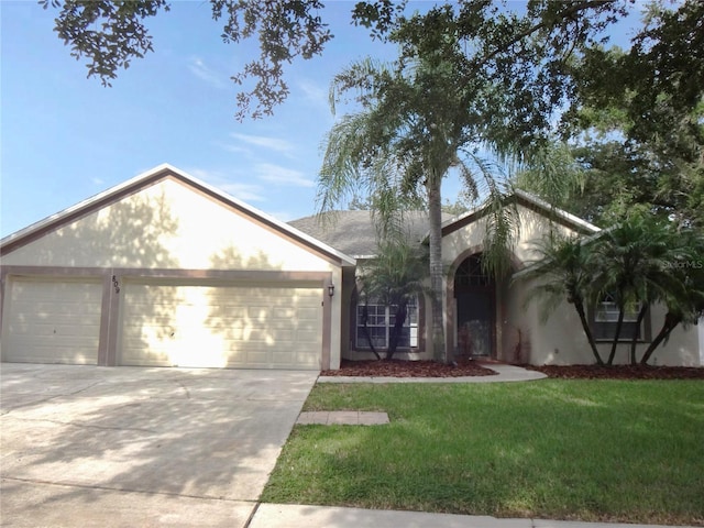 ranch-style home with a front lawn and a garage