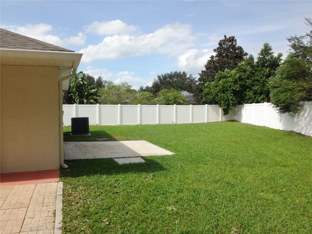 view of yard featuring central AC