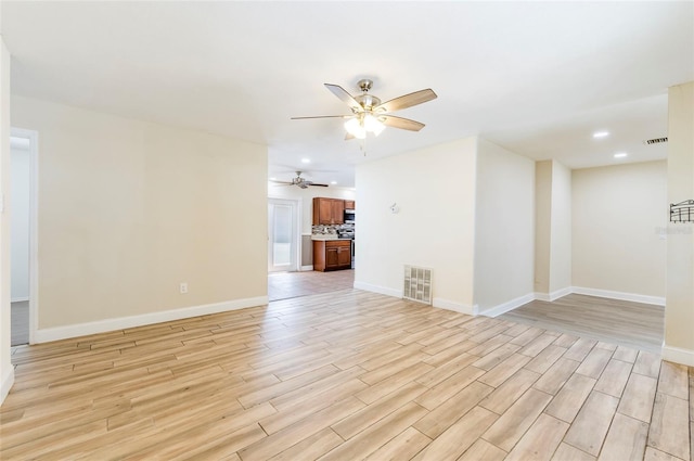 empty room featuring light hardwood / wood-style floors and ceiling fan