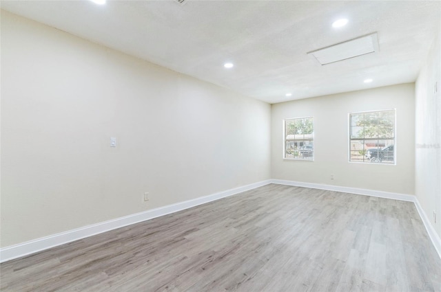 unfurnished room featuring light wood-type flooring