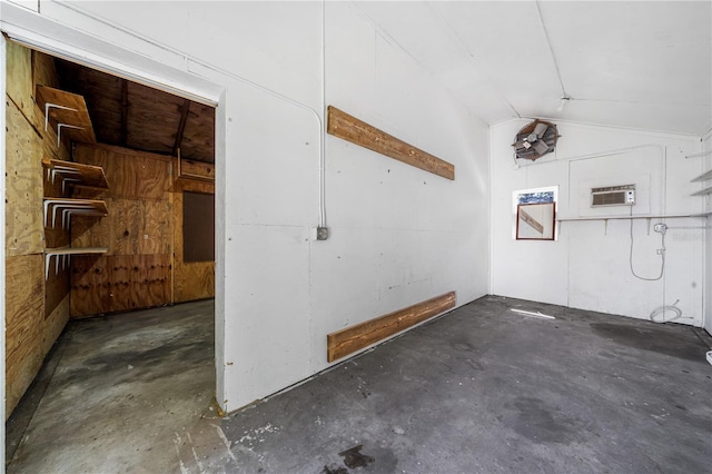 garage featuring a wall mounted air conditioner