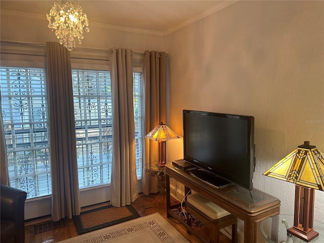 interior space with an inviting chandelier, crown molding, and visible vents