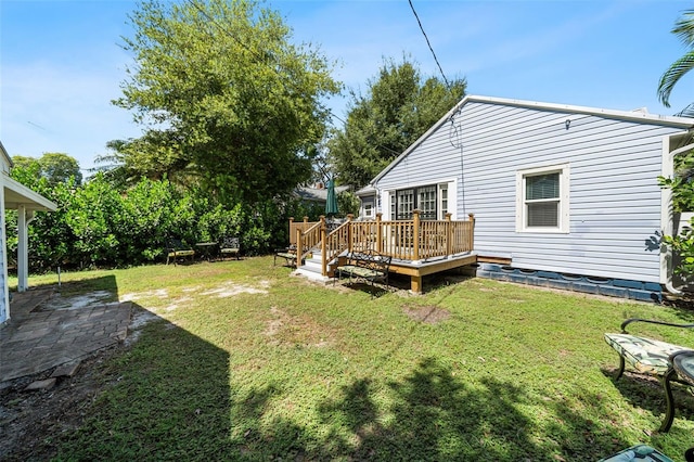 view of yard with a wooden deck