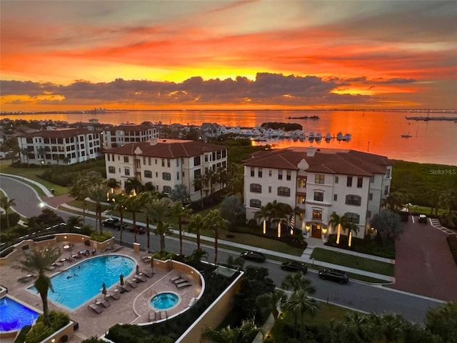 aerial view at dusk with a water view