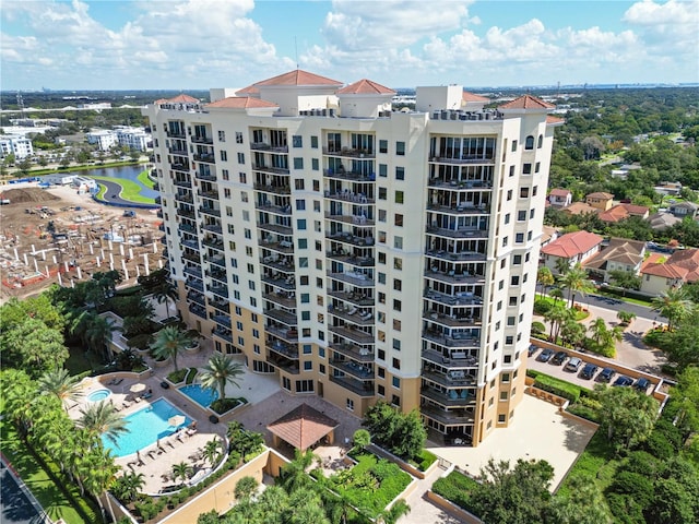 view of building exterior with a community pool