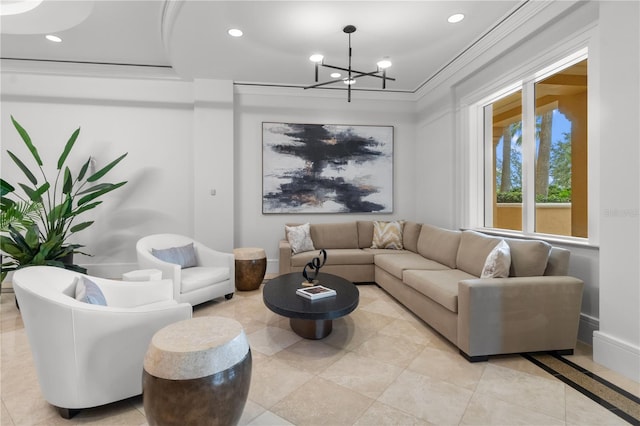 living room featuring an inviting chandelier, ornamental molding, and light tile patterned floors