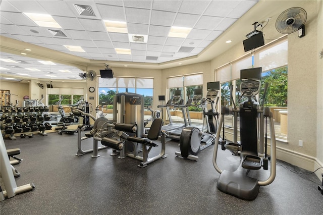 exercise room with a drop ceiling