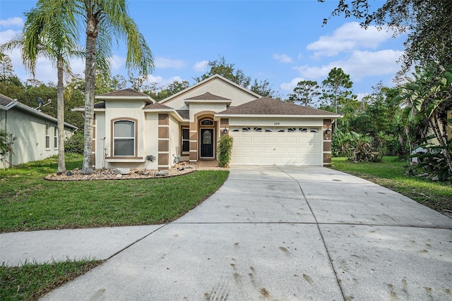 single story home featuring a front yard and a garage