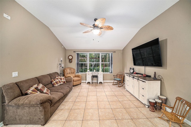 tiled living room with ceiling fan and lofted ceiling