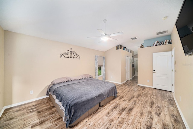 bedroom with ceiling fan and hardwood / wood-style flooring