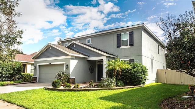 view of front of home featuring a front yard and a garage