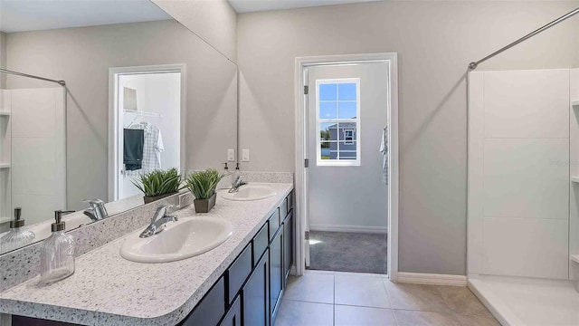 bathroom with vanity, a shower, and tile patterned flooring