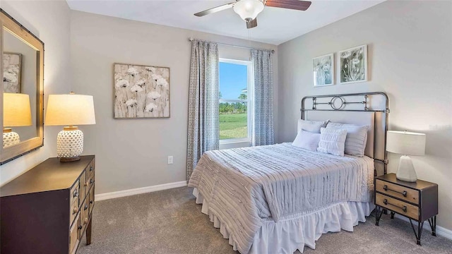 bedroom featuring dark carpet and ceiling fan