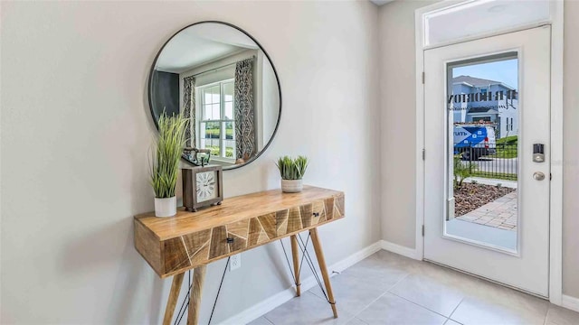 entrance foyer with light tile patterned floors