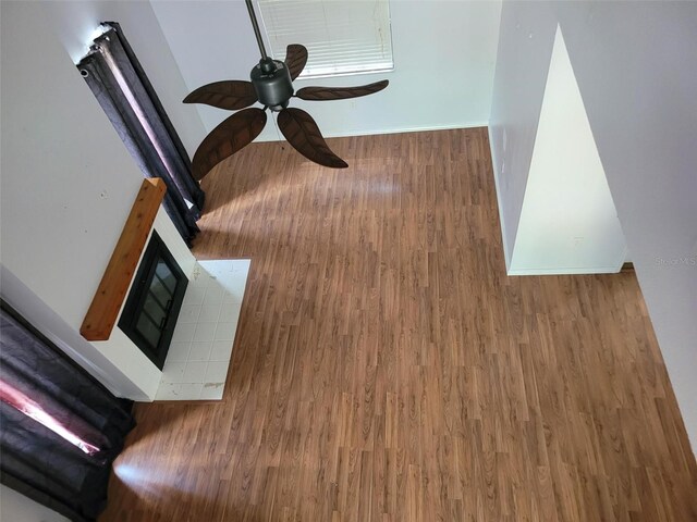 10908 Claymont Dr, New Port Richey, FL 34654 - detailed view of wood finished floors, ceiling fan, and baseboards