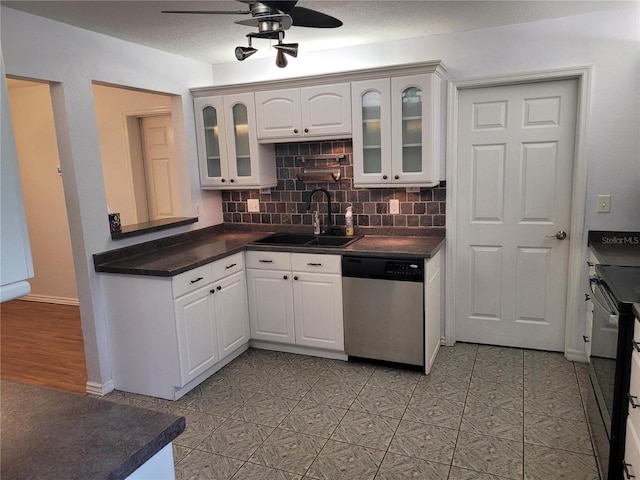 kitchen featuring decorative backsplash, white cabinets, dishwasher, ceiling fan, and sink