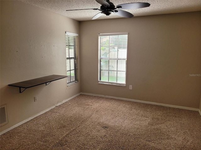 10908 Claymont Dr, New Port Richey, FL 34654 - empty room featuring a textured ceiling, ceiling fan, and carpet floors
