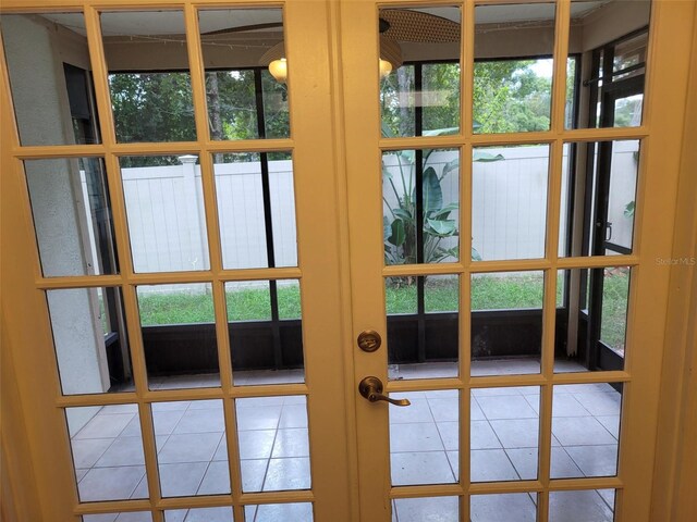 10908 Claymont Dr, New Port Richey, FL 34654 - entryway with tile patterned flooring and french doors