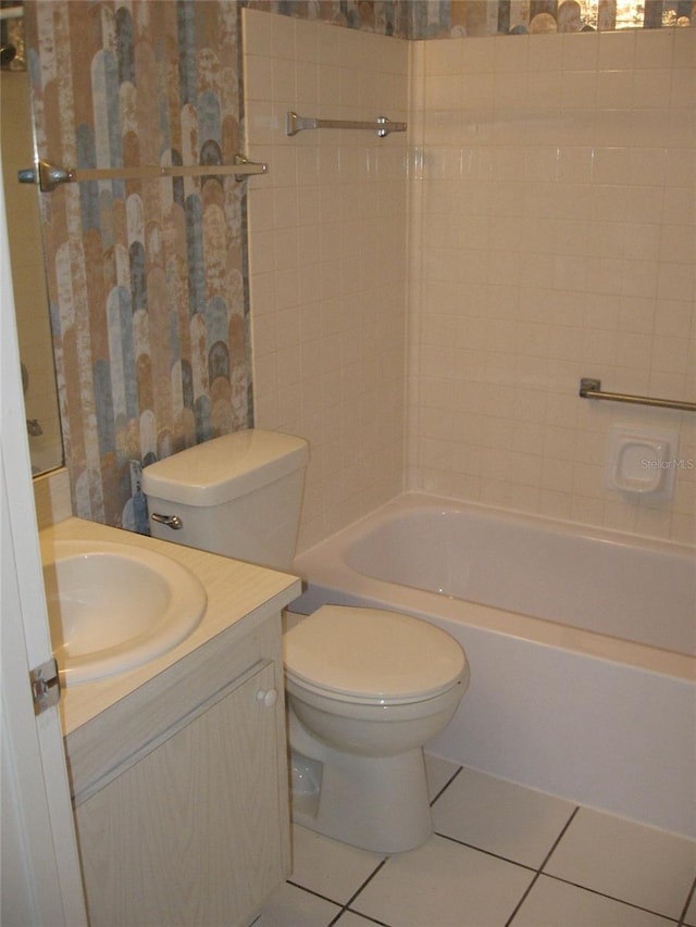 bathroom with tile patterned flooring, vanity, toilet, and wallpapered walls