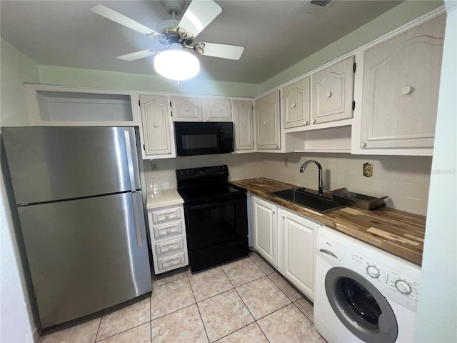 kitchen featuring washer / clothes dryer, sink, butcher block counters, black appliances, and ceiling fan