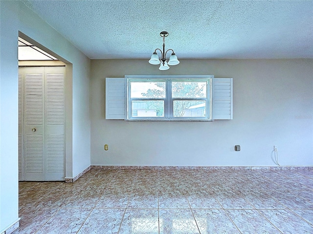 11920 Boynton Ln Unit 11920, New Port Richey, FL 34654 - unfurnished dining area featuring tile patterned flooring, a chandelier, and a textured ceiling