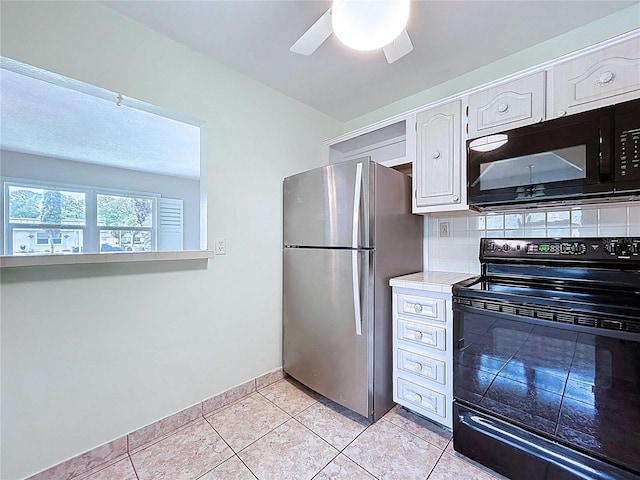 11920 Boynton Ln Unit 11920, New Port Richey, FL 34654 - kitchen featuring tasteful backsplash, black appliances, light tile patterned flooring, ceiling fan, and white cabinets
