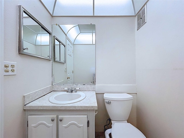 11920 Boynton Ln Unit 11920, New Port Richey, FL 34654 - bathroom with visible vents, vanity, and toilet