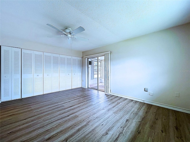 11920 Boynton Ln Unit 11920, New Port Richey, FL 34654 - interior space with baseboards, a ceiling fan, wood finished floors, and a textured ceiling