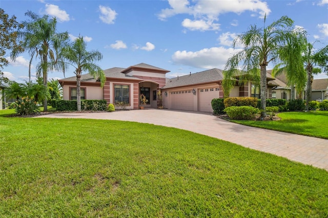 view of front facade with a garage and a front yard