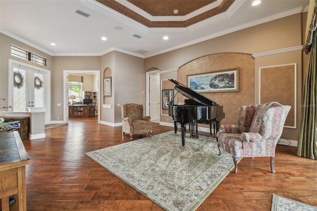 living area featuring a tray ceiling, crown molding, and dark hardwood / wood-style flooring