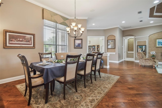 dining area with a notable chandelier, crown molding, and dark wood-type flooring